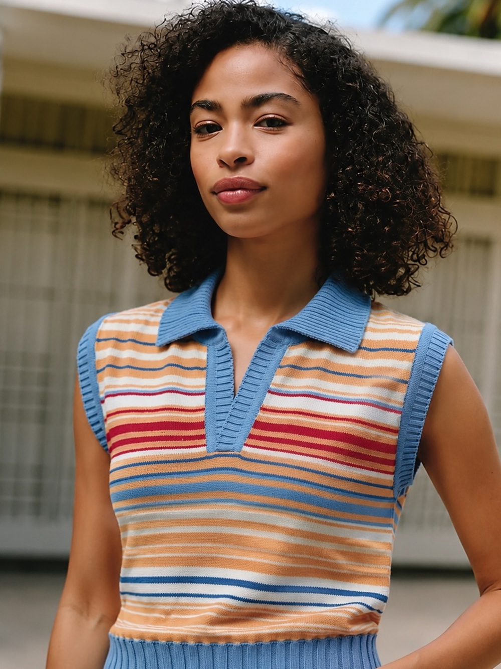 UNI sleeveless knitted polo top, size S, featuring multicolored horizontal strip